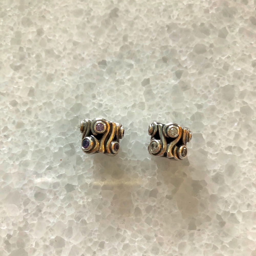 Pandora log charms with crystals.